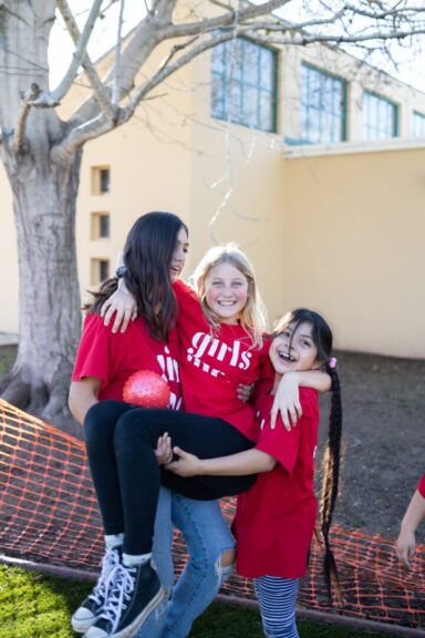 Two Girls Carrying