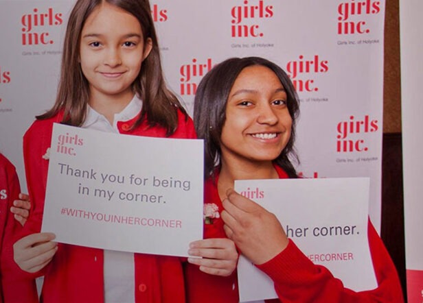 Girls Holding Up Thank You Sign